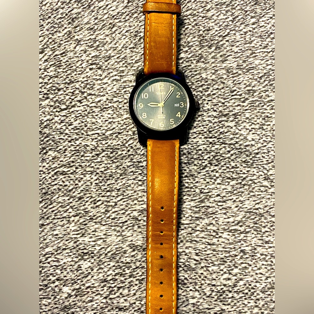 Timex Men’s Indiglo WR50M watch with tan adjustable leather strap.